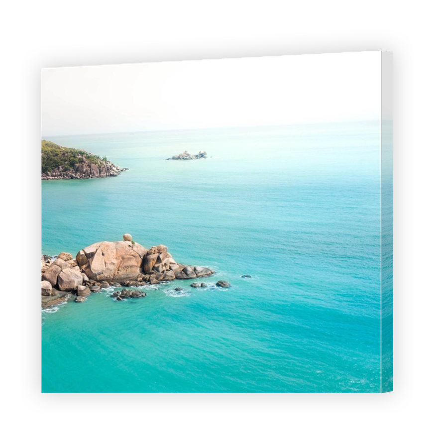 Aerial views over a tropical island in a middle of an archipelago