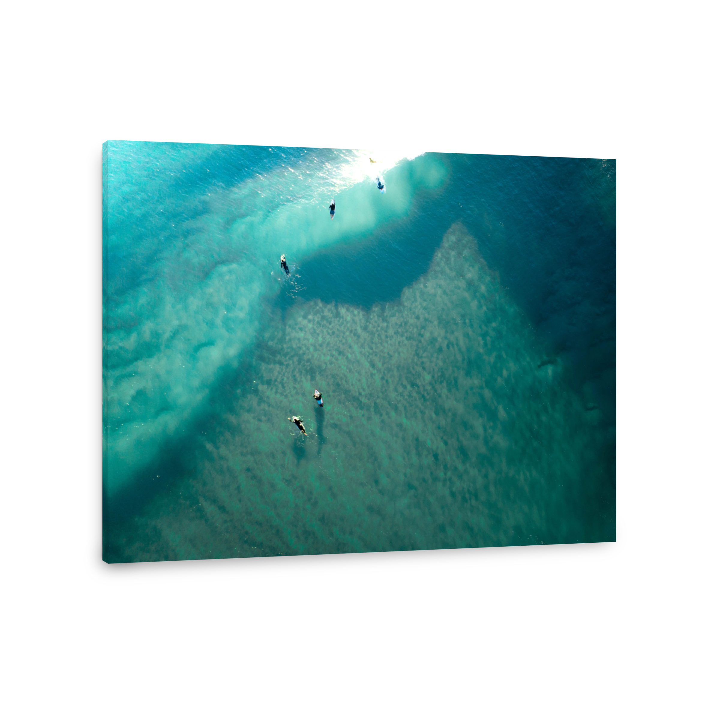 Ocean aerial landscape of surfer waiting for waves at sunrise with a beautiful light.