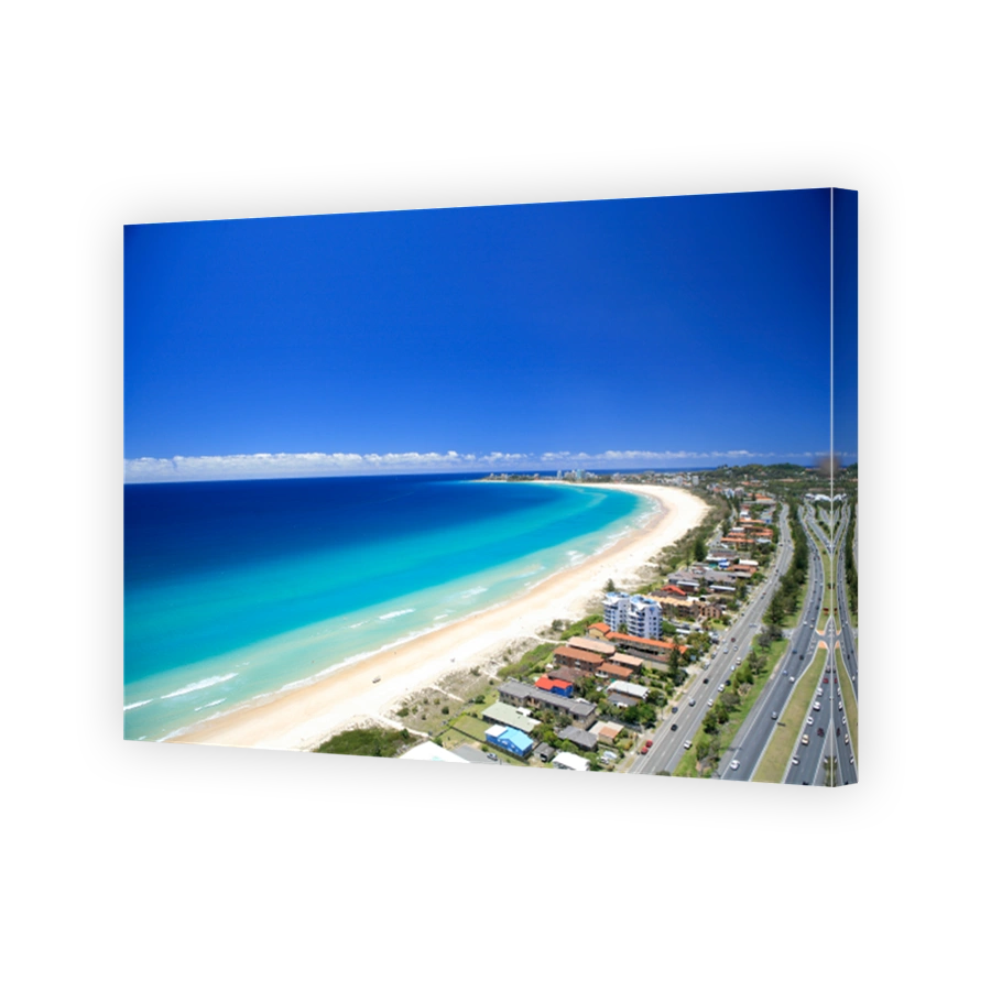 An aerial view of the vibrant blue water at Kirra and Tugan Beach near Coolangatta airport