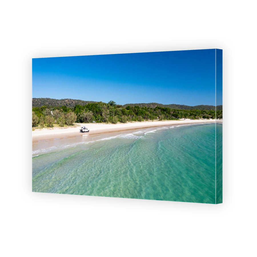 4WD off-road vehicle driving on beach, Moreton Island, Queensland