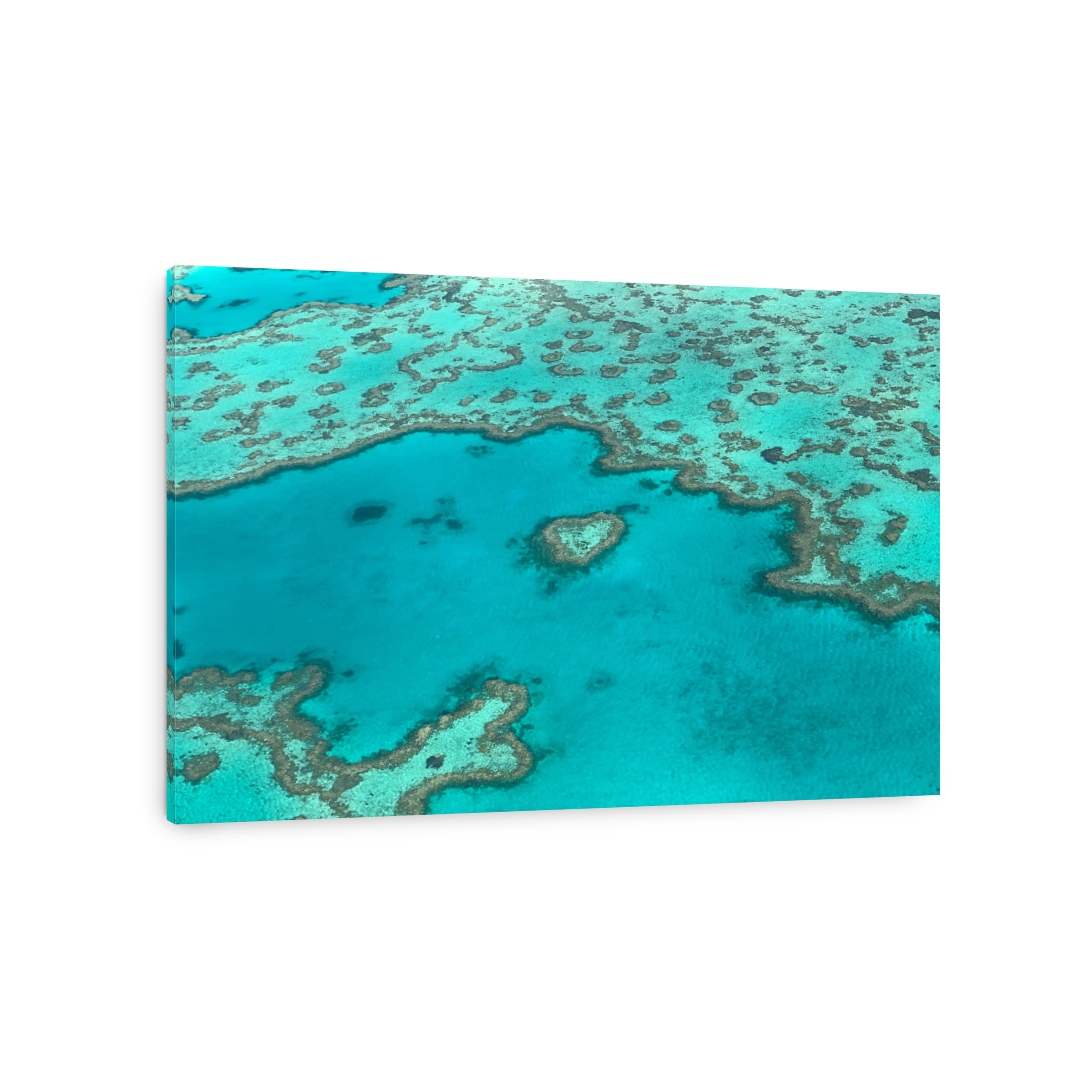 Aerial view of a heart-shaped reef in Whitsunday Islands, Australia