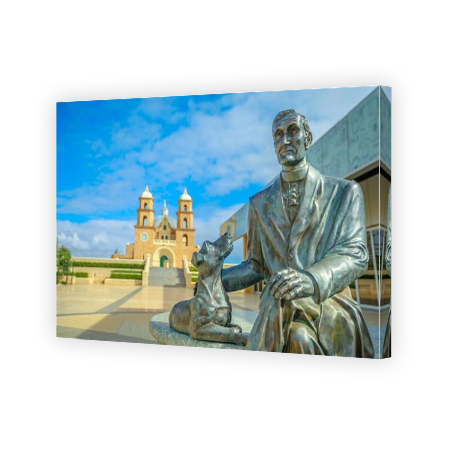 Geraldton, Australia - Dec 18, 2017: Statue of Monsignor John Hawes on foregound with St. Francis Xavier Cathedral behind on blurred background, in Geraldton, Western Australia. Sunny day.