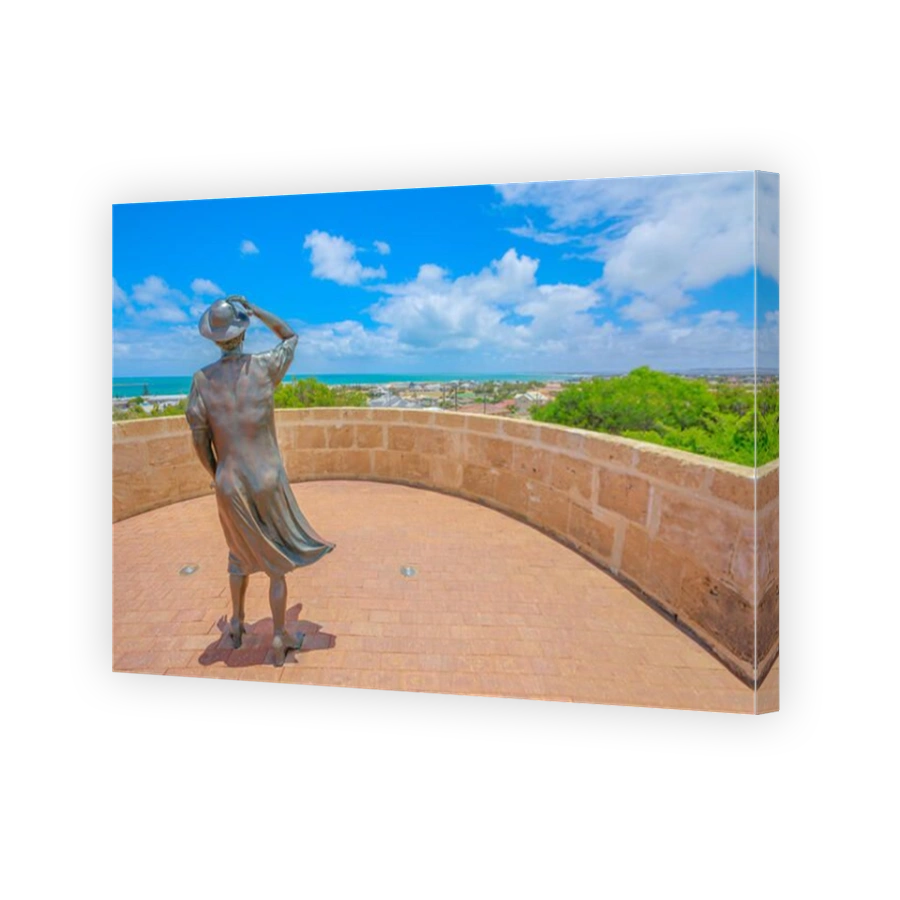 Geraldton, Australia - Dec 18, 2017: the Waiting Woman statue at HMAS Sydney II Memorial in Geraldton, atop Mount Scott overlooking the port of the city in Western Australia. Sunny day with blue sky.