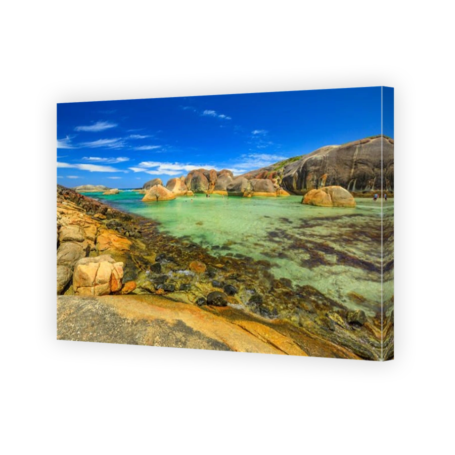 Scenic landscape of huge cracked oval boulders makes a stunning sight as they gaze out upon the Great Southern Ocean. Elephant Rocks in William Bay National Park near Denmark, Western Australia.