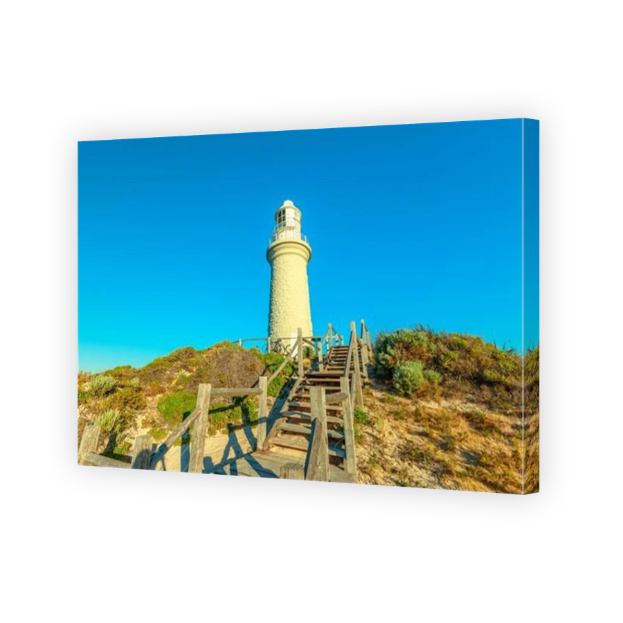 Stairs leading up to Bathurst Lighthouse in north coast of Rottnest Island, near Perth, Western Australia. Sunny afternoon with blue sky.