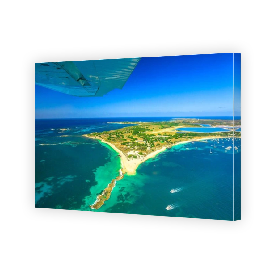 Aerial view of Rottnest Island in Australia. Scenic flight with wing of plane over famous tourist destination of Western Australia. Rottnest Island is