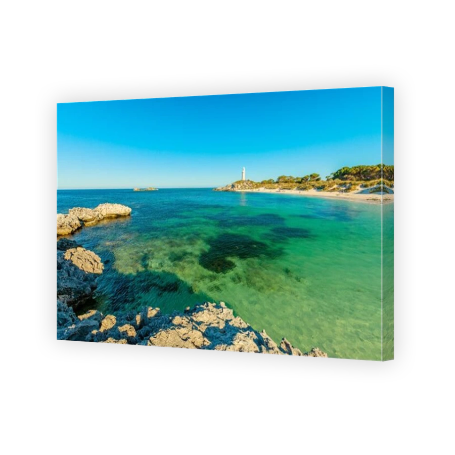 Pinky Beach and Bathurst Lighthouse on background. Turquoise sea and white pristine beach in north coast of Rottnest Island, near Perth, Western