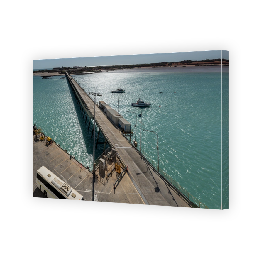 Bridge in Broome in Western Australia in the sea with cruise ships floating on it
