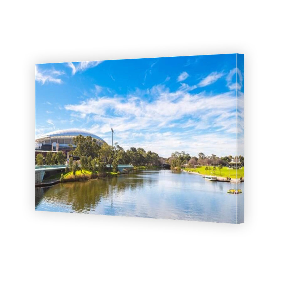 Adelaide, Australia - August 4, 2019: Adelaide Oval viewed across Torrens river from the footbridge on a day