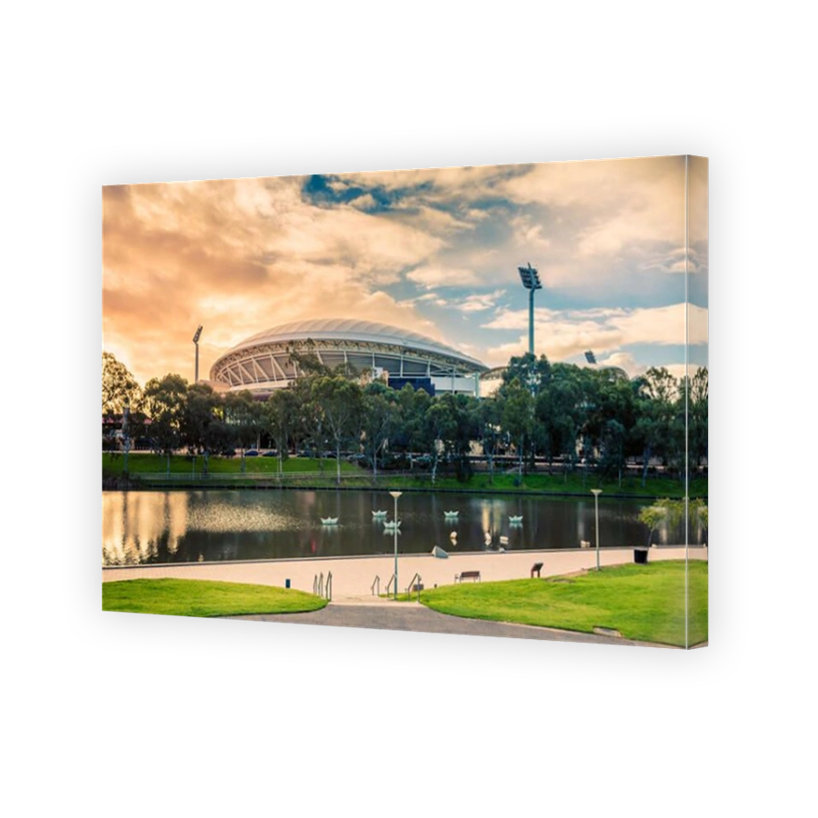 Adelaide, Australia - August 27, 2017: Adelaide Oval viewed across Torrens river in Elder Park at sunset