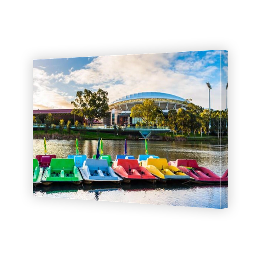 Adelaide, Australia - August 27, 2017: Adelaide Oval viewed across Torrens river in Elder Park at sunset