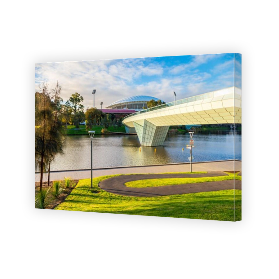 Adelaide, Australia - August 27, 2017: Iconic River Torrens Footbridge to Adelaide Oval viewed across Elder Park on bright day