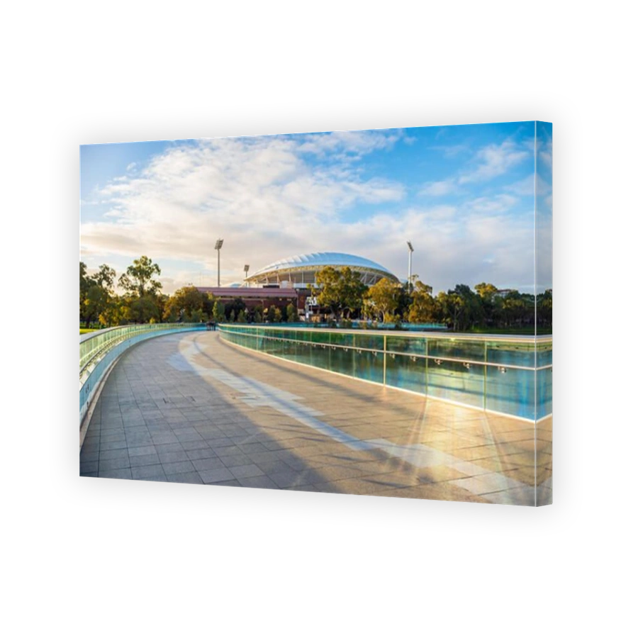 Adelaide, Australia - August 27, 2017: Iconic River Torrens Footbridge to Adelaide Oval viewed across Elder Park on bright day
