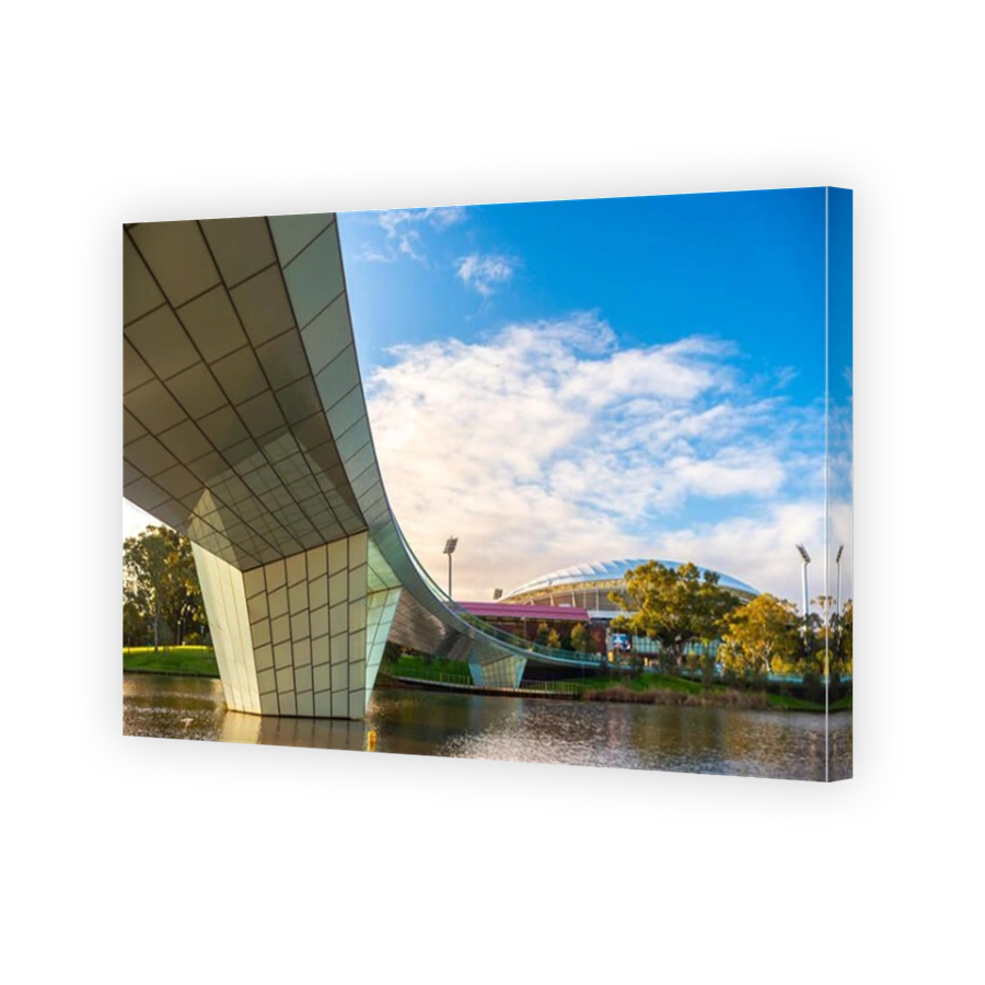 Adelaide, Australia - August 27, 2017: Iconic River Torrens Footbridge to Adelaide Oval viewed across Elder Park on bright day