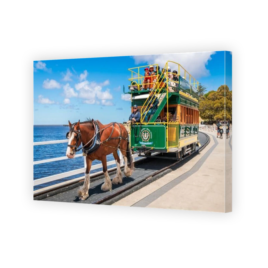 Victor Harbor, South Australia - January 5, 2022: Victor Harbor Horse Drawn Tram with people on the way to the Granite Island via the newly constructe