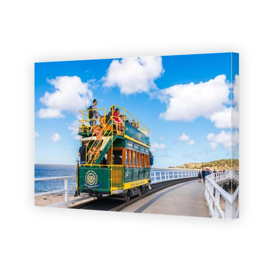 Victor Harbor, South Australia - January 5, 2022: Victor Harbor Horse Drawn Tram with people on the way to the Granite Island via the newly constructe