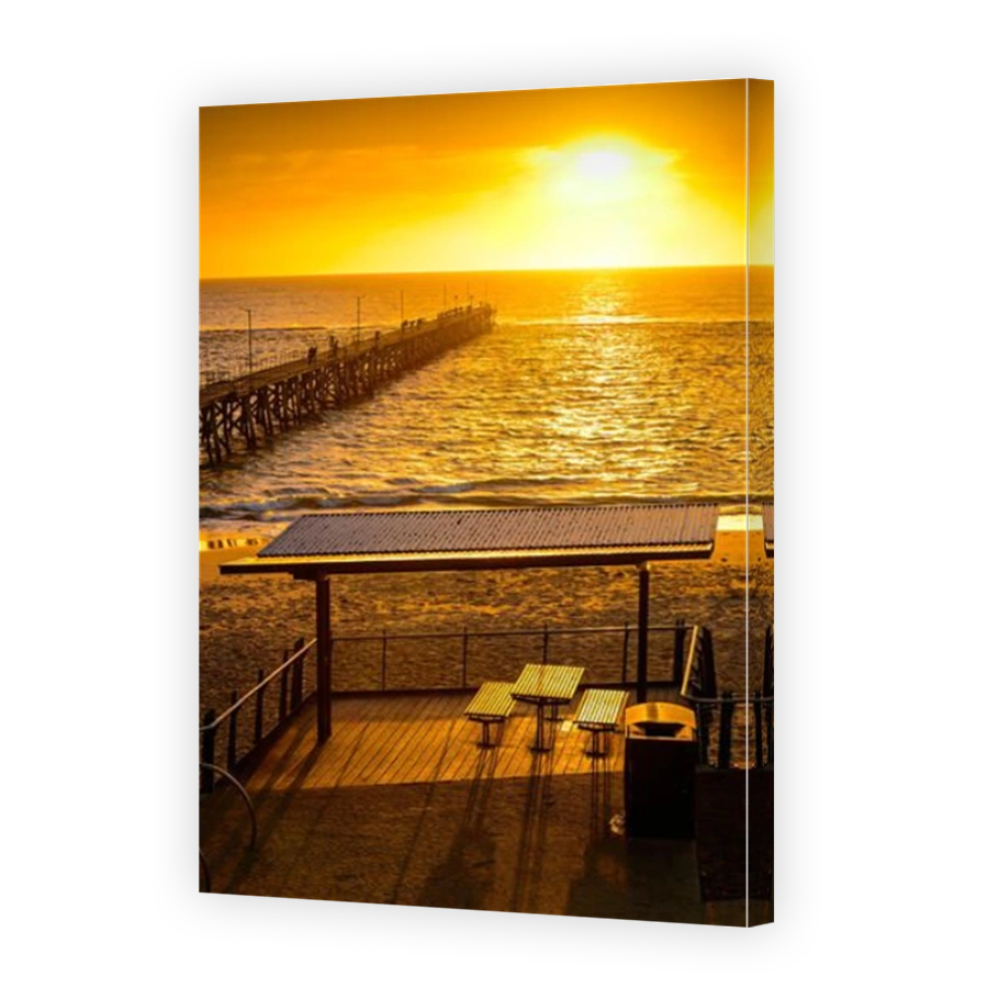 Picnic area near Port Noarlunga jetty with fishermen at sunset, South Australia