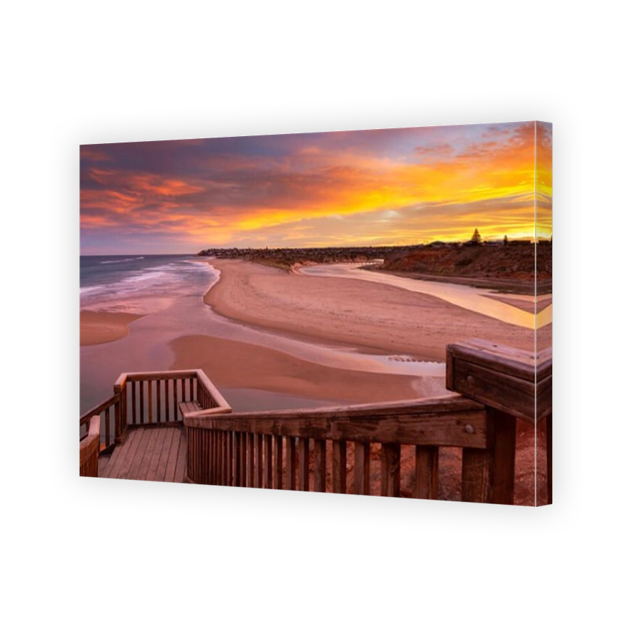 A beautiful sunrise at southport port noarlunga south australia overlooking the wooden staircase ocean and cliffs on the 30th April 2019