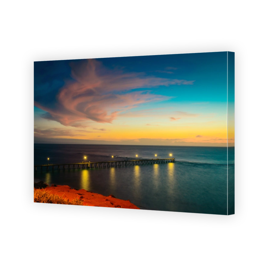 Port Noarlunga pier with light on after sunset