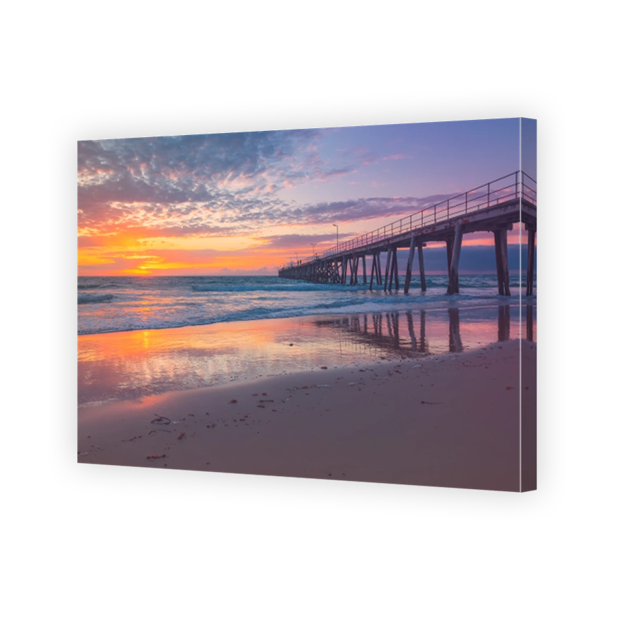 Port Noarlunga jetty with people during pink sunset