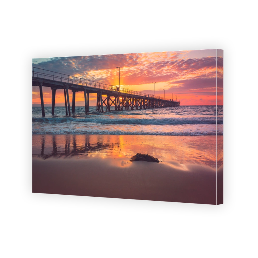 Port Noarlunga jetty with people during pink sunset