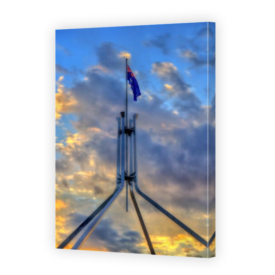 The Australian flag flying on top of Parliament House in Canberra