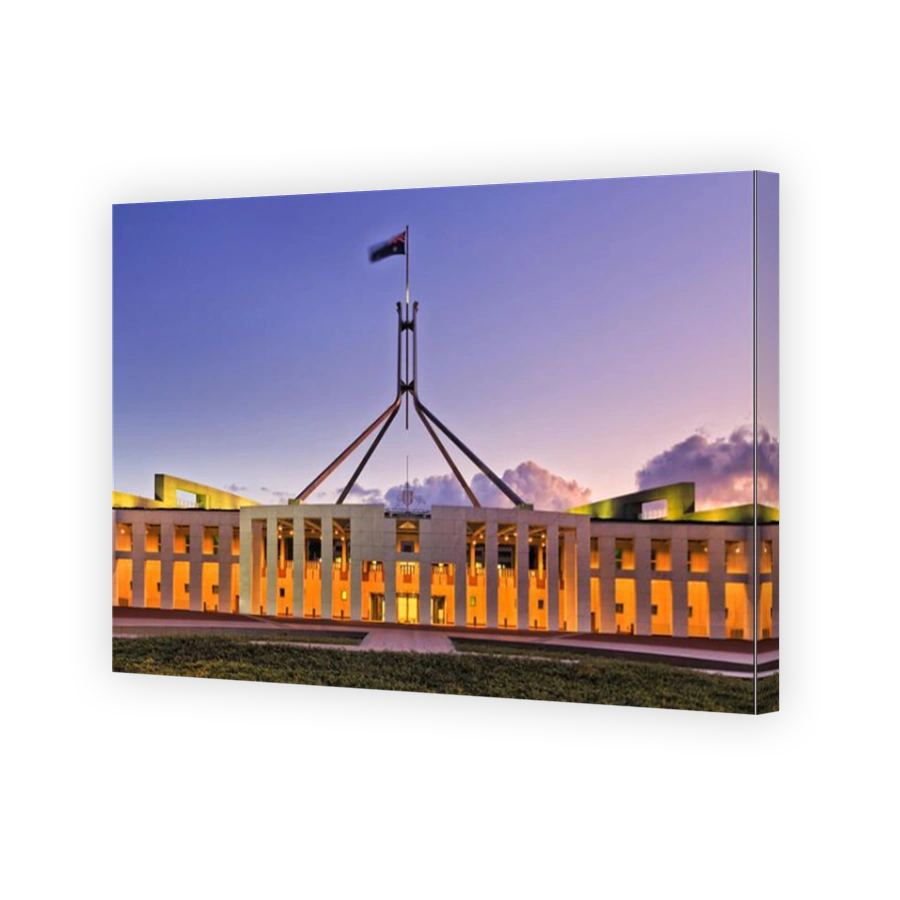 Close-up facade, columns and entrance to Canberra's Parliament house at sunset. State symbol and senate of Australia has free
