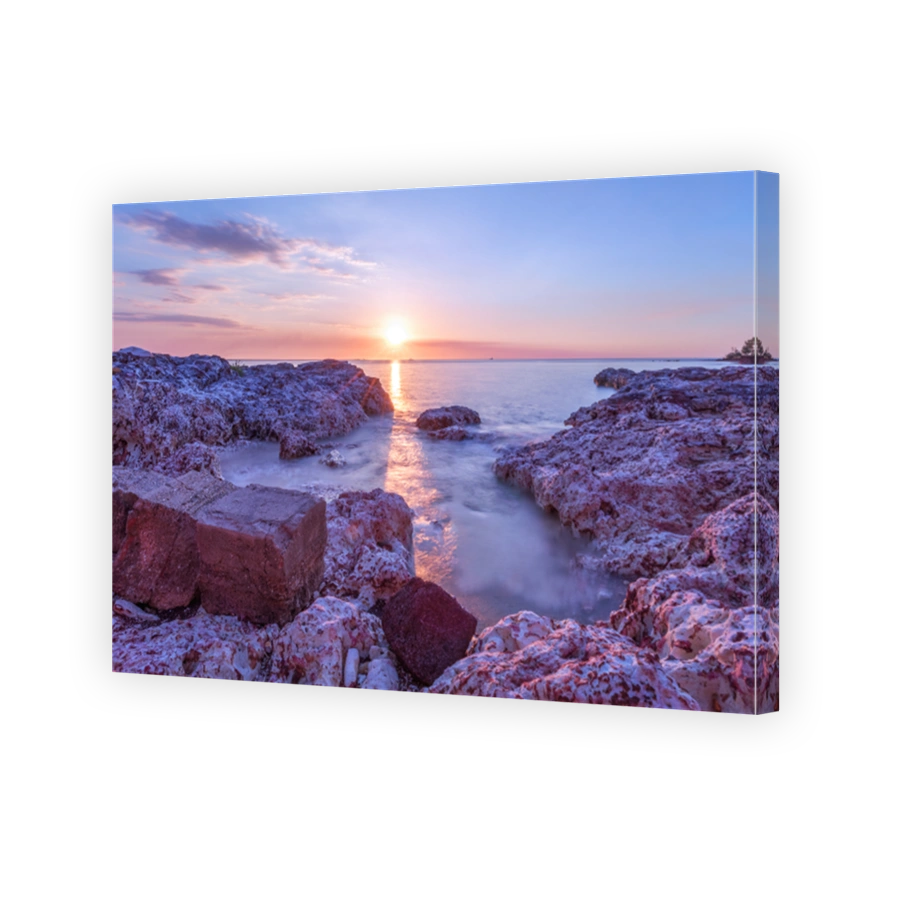 Sunset over rocky beach