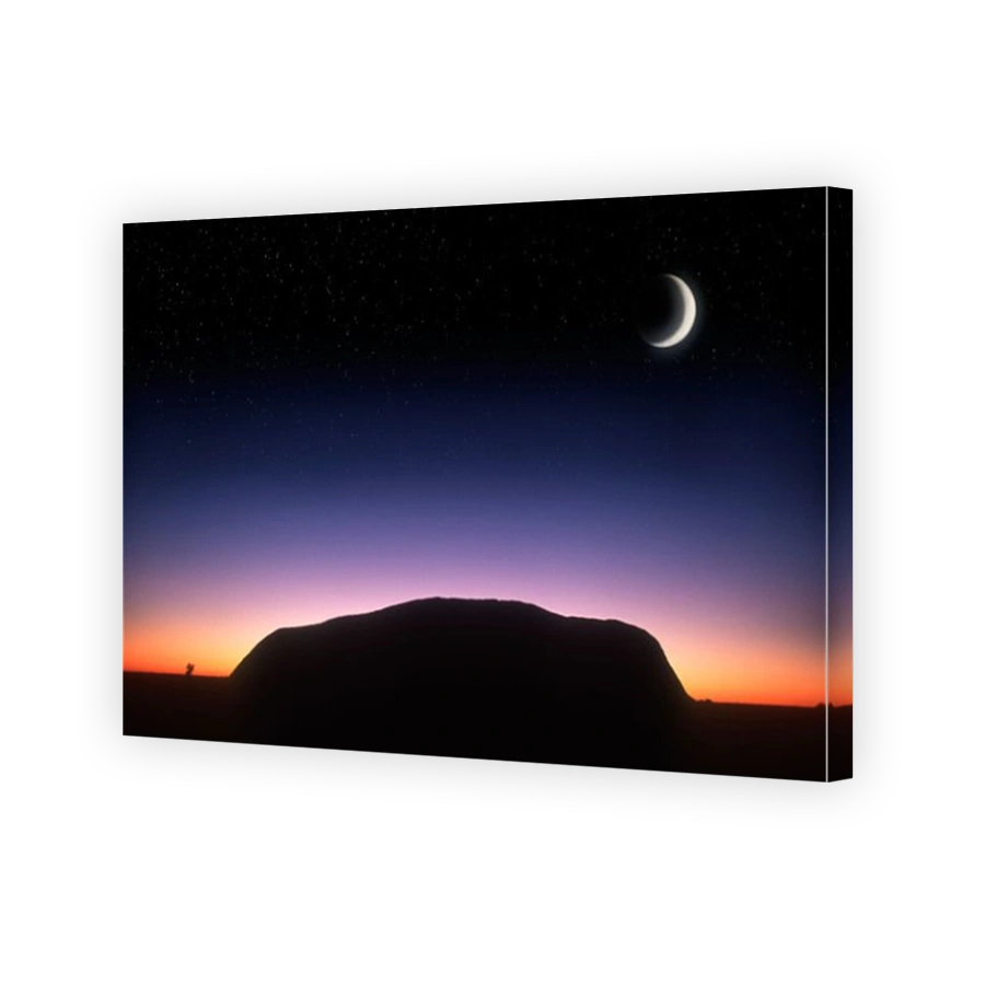 Scenery Ayers Rock in silhouette at sunrise with moon Kata Tjutu National Park Australia