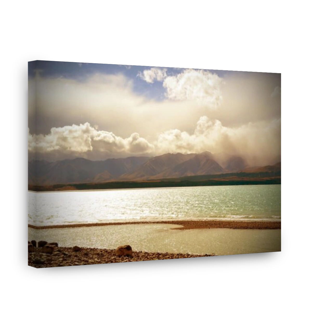 Clouds rolling in over mountains surrounding the shining waters of Lake Pukaki, New Zealand