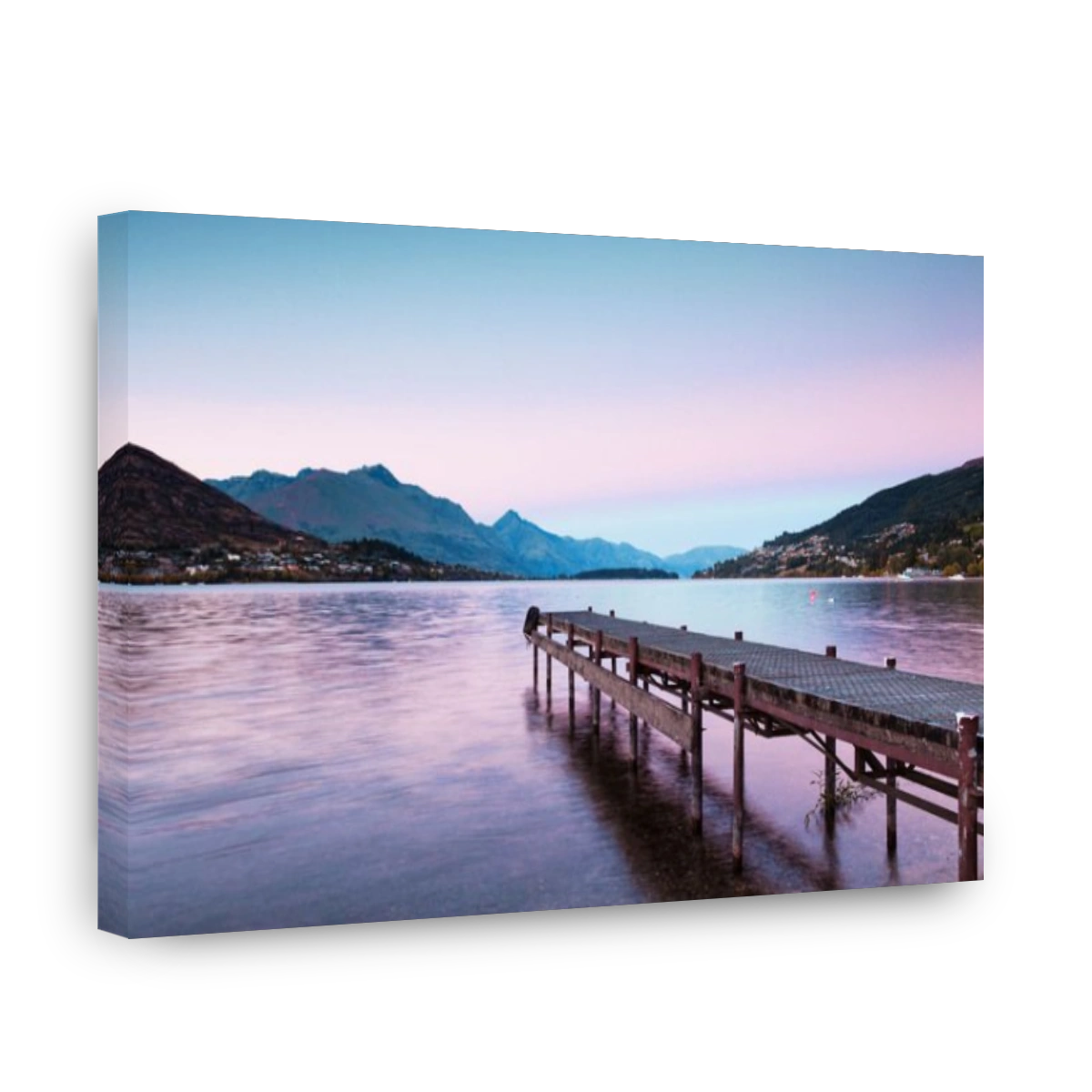An old jetty on the shores of Lake Wakatipu, Queenstown, Otago, New Zealand, and Queenstown in the distance.