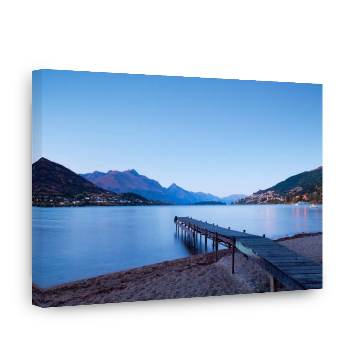 An old jetty on the shores of Lake Wakatipu, Queenstown, Otago, New Zealand, and Queenstown in the distance.