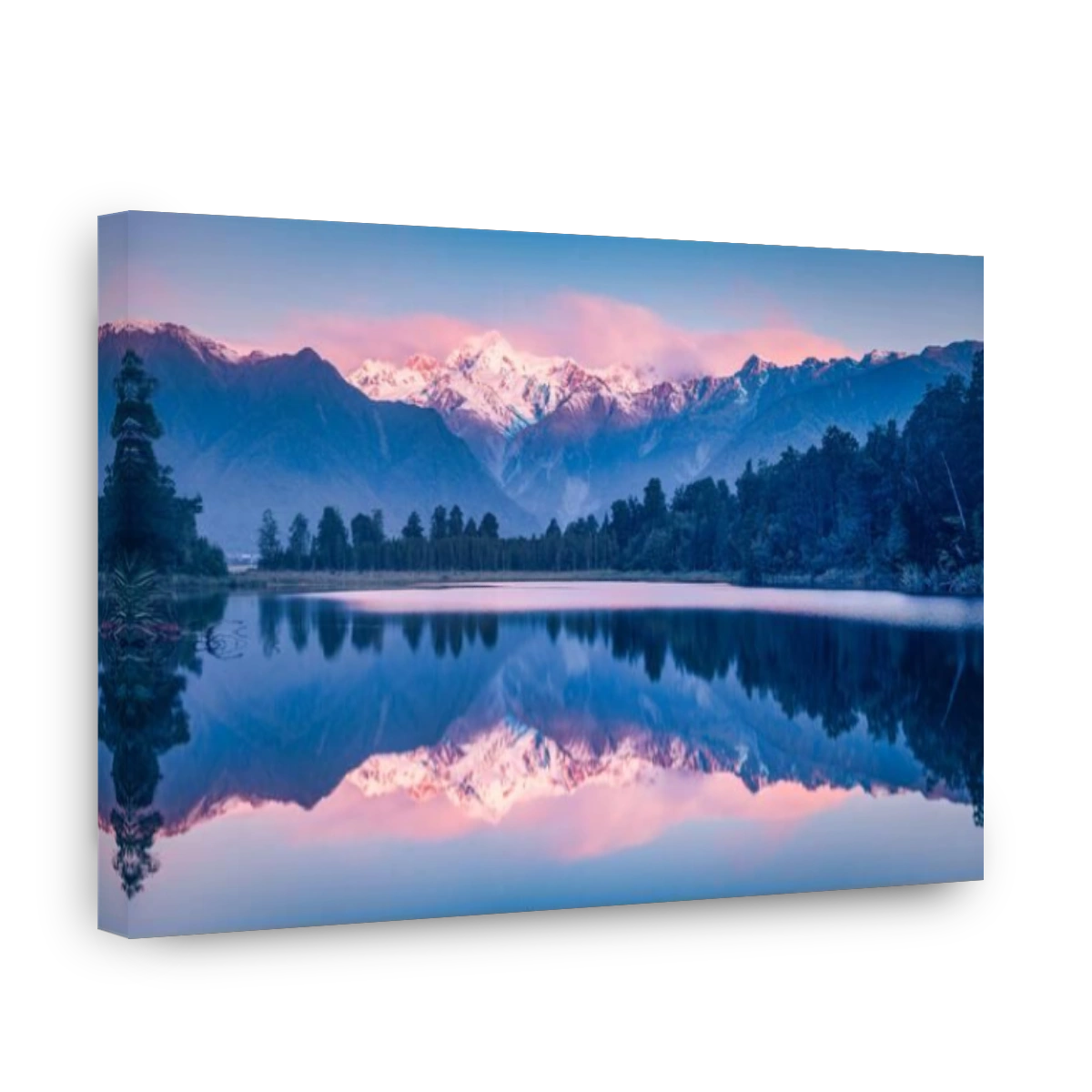 Lake Matheson at sunset with snow covered Mount Tasman and, in the cloud, Aoraki Mount Cook, New Zealand's highest mountain.