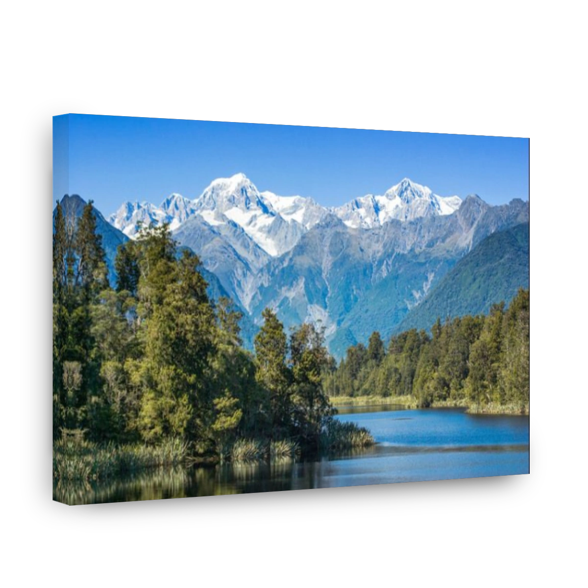 Lake Matheson with snow covered Mount Tasman and Mount Cook, New Zealand's highest mountain. Mount Cook is on the right.