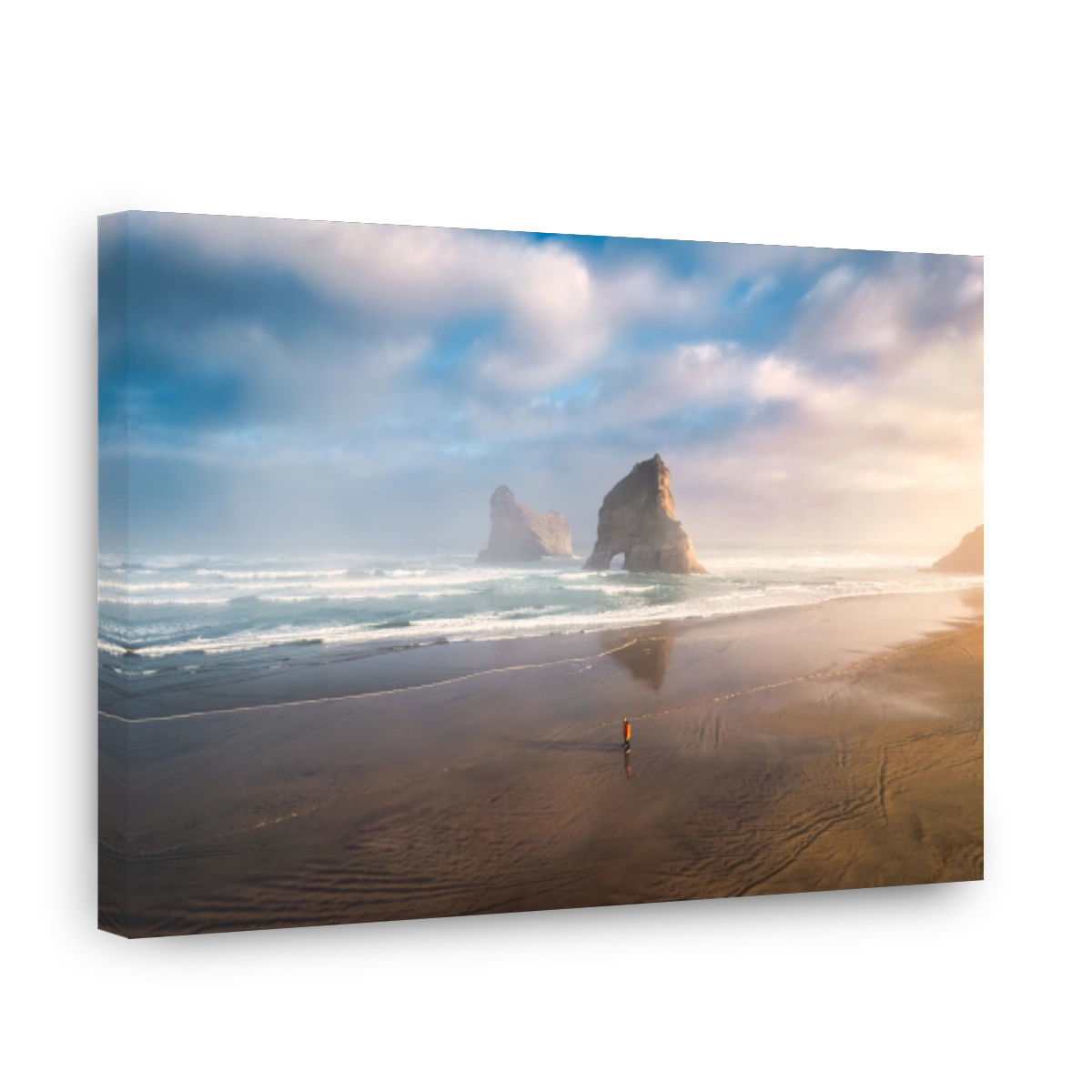 Serene beach sunrise over Wharariki archway islands, New Zealand