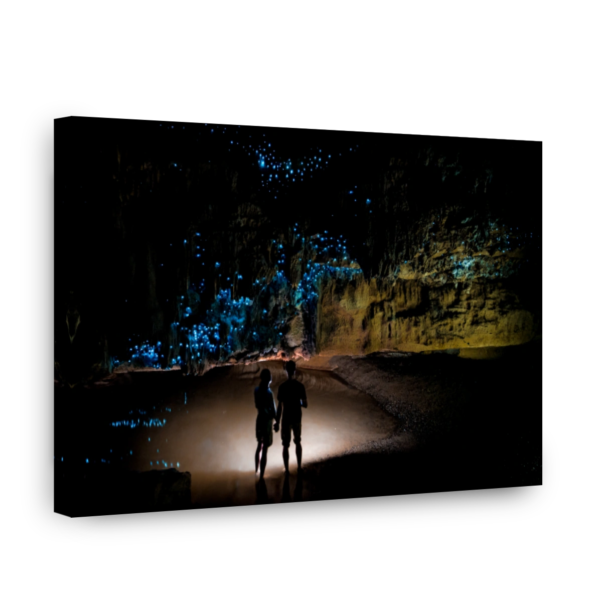 Couple Admiring Glow Worms in Waipu Cave, New Zealand