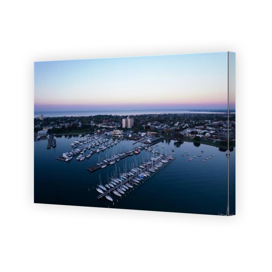 An aerial of the marina at sunset with many yachts attached to the pier, Williamstown, Melbourne.