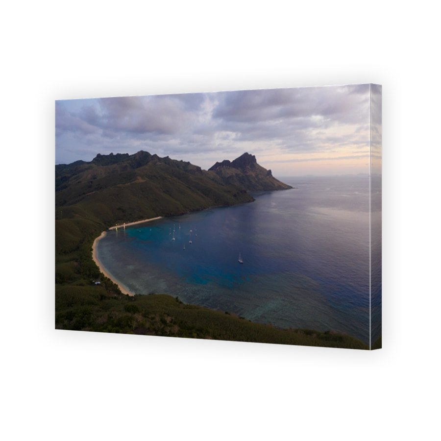 Dramatic sunset over the Waya island, home of the octopus resort, in the Yasawa group in Fiji, in the south Pacific ocean