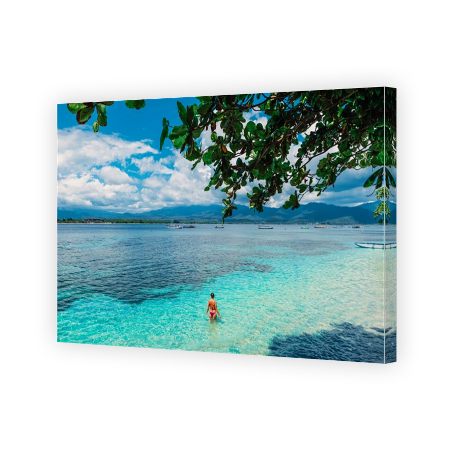 Young bikini woman relax in blue ocean on tropical island