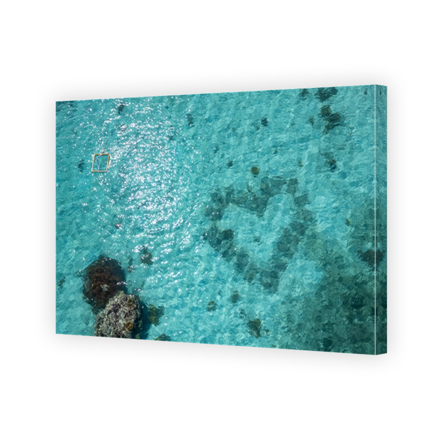 Aerial view above tropical paradise islands and coral reef