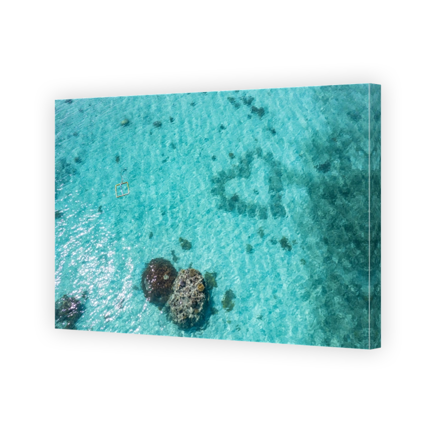 Aerial view above tropical paradise islands and coral reef
