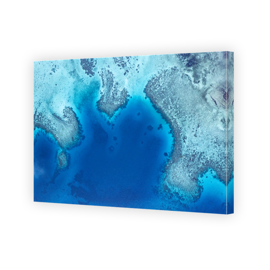 Aerial view of coral reef surrounding tropical Island