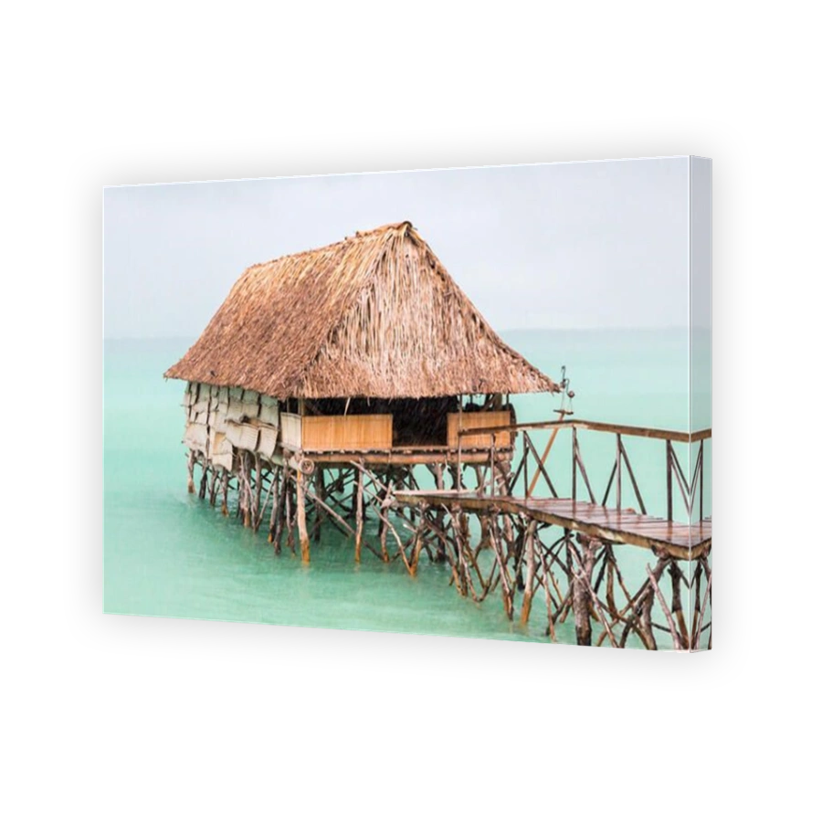 Overwater thatched roof bungalow hut of Micronesian people, lagoon of South Tarawa, heavy rain shower, wet season, Kiribati, Micronesia, Oceania.