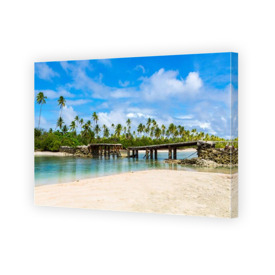 Broken bridge under palm trees between islets over lagoon, North Tarawa atoll, Kiribati, Micronesia, Gilbert islands, Oceania, South Pacific Ocean.