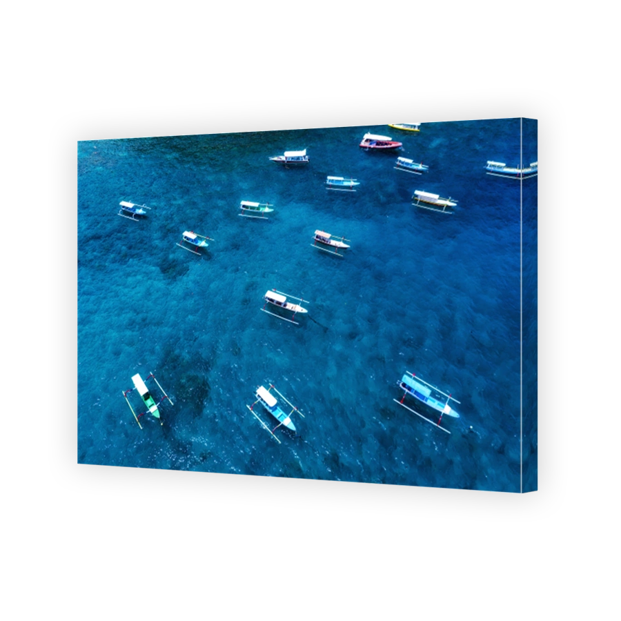 Boats in the blue lagoon. Aerial view of floating boat on transparent turquoise water at sunny day. Top view from drone. Seascape with motorboat in bay. Travel - image