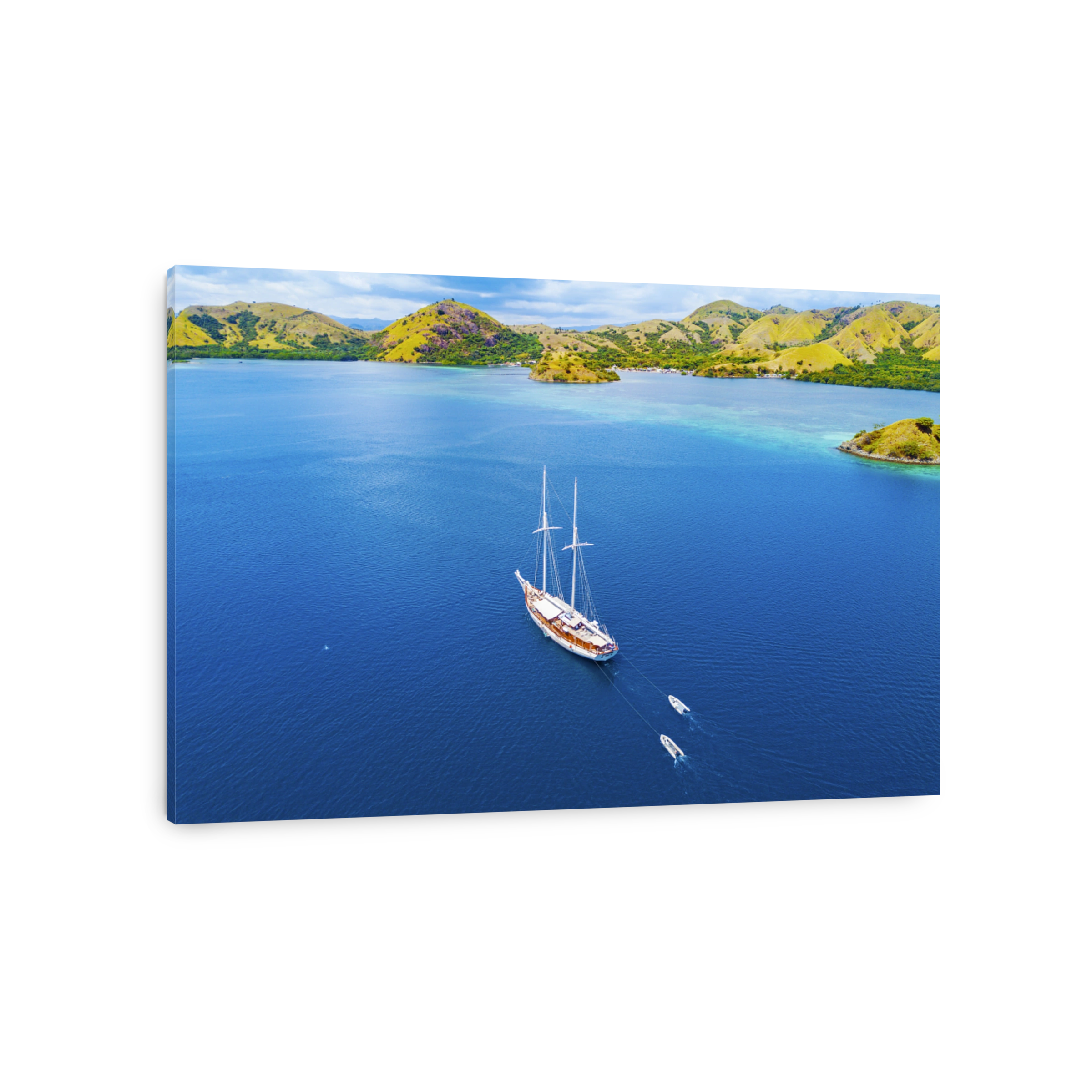 Arial view of beautiful scenery at Flores island with tourist yatch, turqouise and dark blue sea.