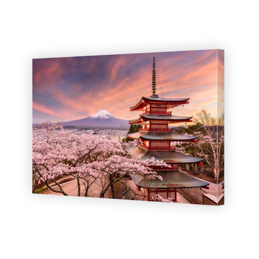 Fujiyoshida, Japan at Chureito Pagoda and Mt. Fuji in the spring with cherry blossoms.
