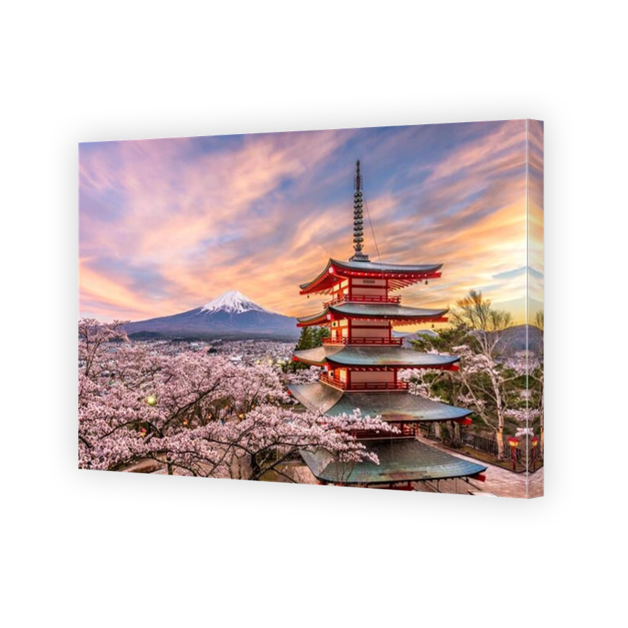 Fujiyoshida, Japan at Chureito Pagoda and Mt. Fuji in the spring with cherry blossoms.