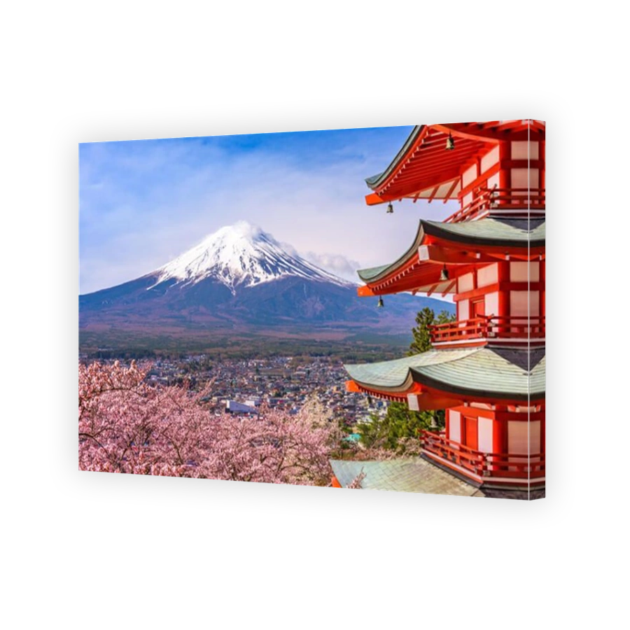Fujiyoshida, Japan at Chureito Pagoda and Mt. Fuji in the spring with cherry blossoms.