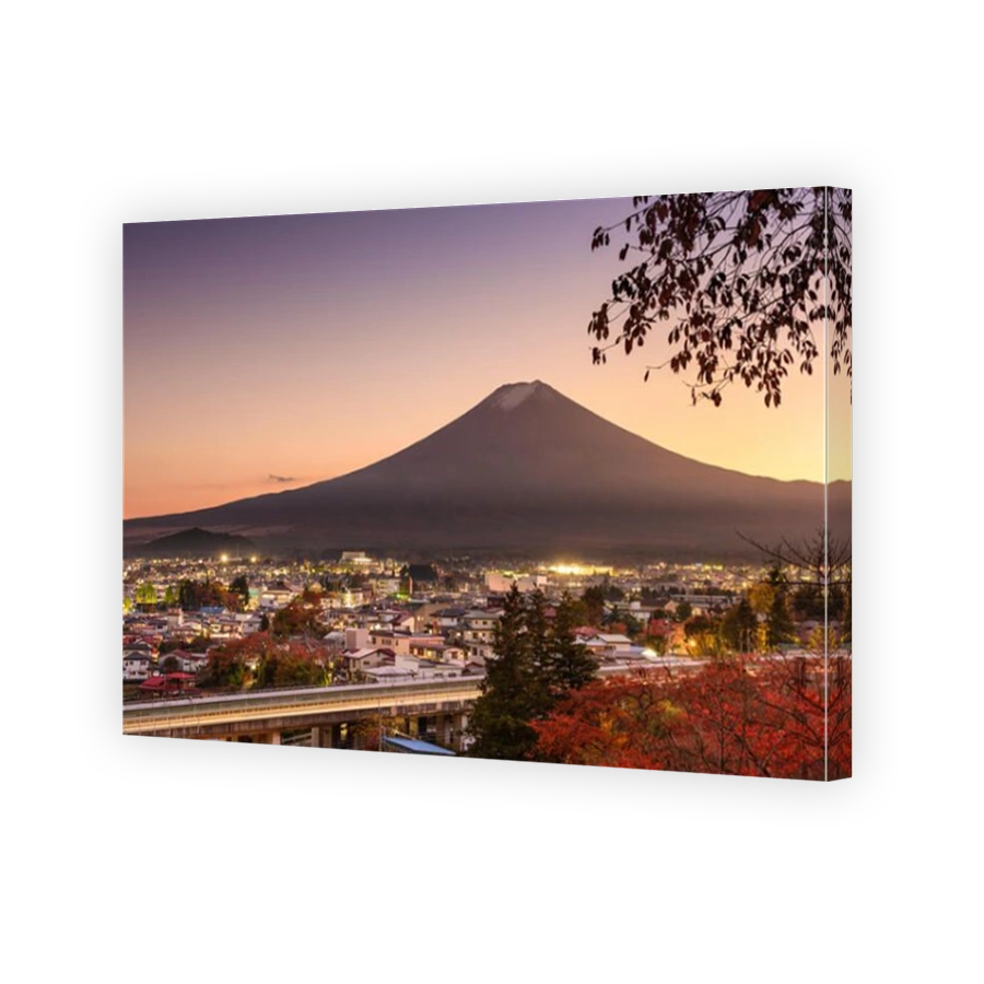 Mt. Fuji rises over Fujiyoshida, Japan in autumn.
